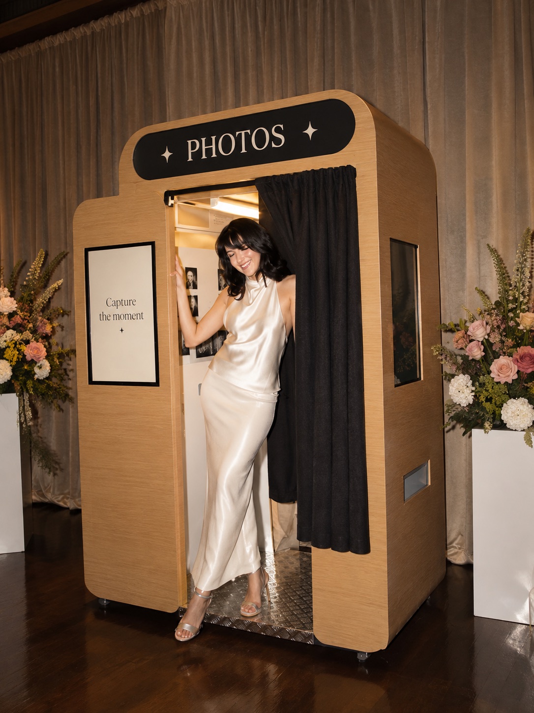 Bride sharing a champagne toast inside the Flash & Frame booth